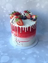 red & white buttercream drip cake